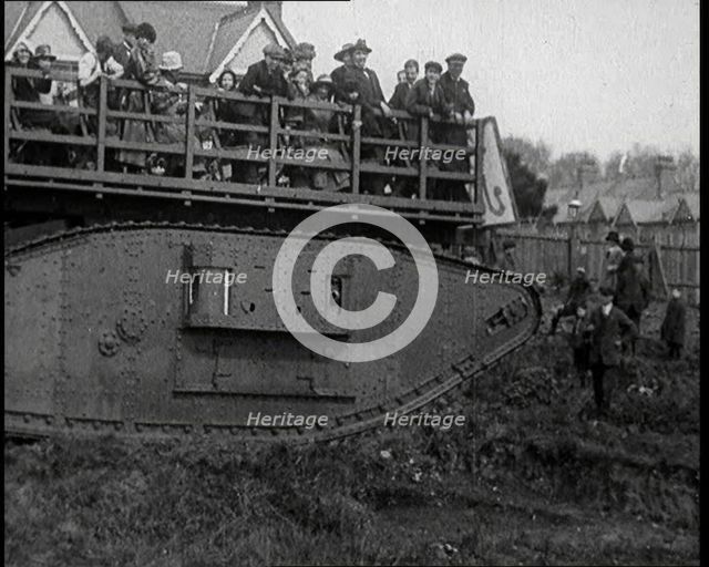 People Riding a Tank Over Rough Terrain, 1920. Creator: British Pathe Ltd.