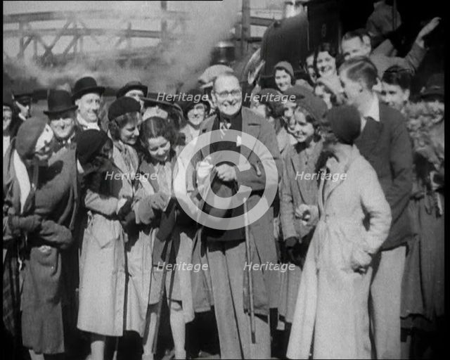 People Standing at  a Train Station, 1933. Creator: British Pathe Ltd.