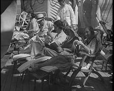 People Sitting on Deck Chairs on the Deck of a Cruise Liner Whilst at Sea, 1931. Creator: British Pathe Ltd