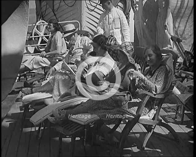 People Sitting on Deck Chairs on the Deck of a Cruise Liner Whilst at Sea, 1931. Creator: British Pathe Ltd.