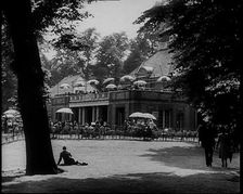 People Walking and Relaxing in the Park, 1933. Creator: British Pathe Ltd