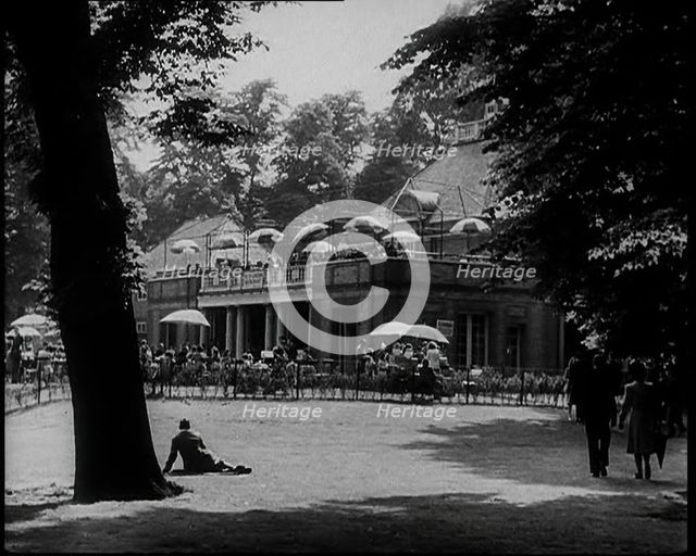 People Walking and Relaxing in the Park, 1933. Creator: British Pathe Ltd.