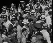 People Walking Around on a Crowded Street, 1930s. Creator: British Pathe Ltd