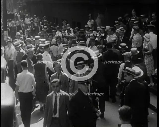 People Walking Around on a Crowded Street, 1930s. Creator: British Pathe Ltd.