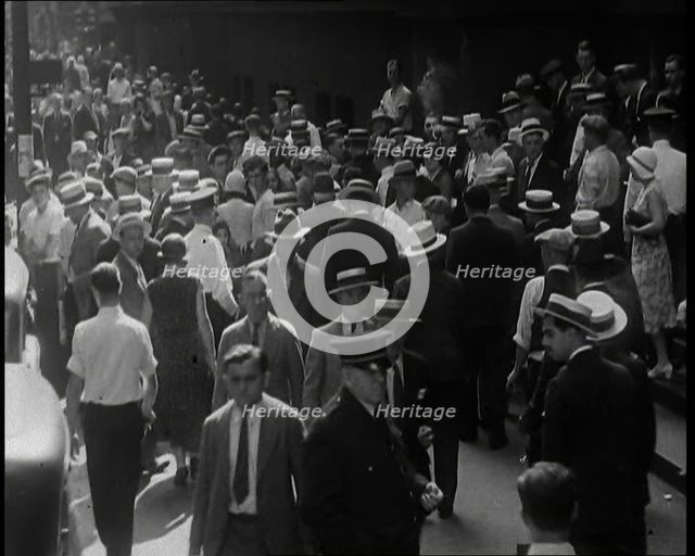 People Walking Around on a Crowded Street, 1930s. Creator: British Pathe Ltd.