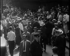 People Walking Around on a Crowded Street, 1930s. Creator: British Pathe Ltd