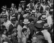 People Walking Around on a Crowded Street, 1930s. Creator: British Pathe Ltd