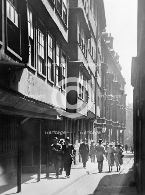 People walking down Temple Lane, Westminster, London. Creator: Unknown.