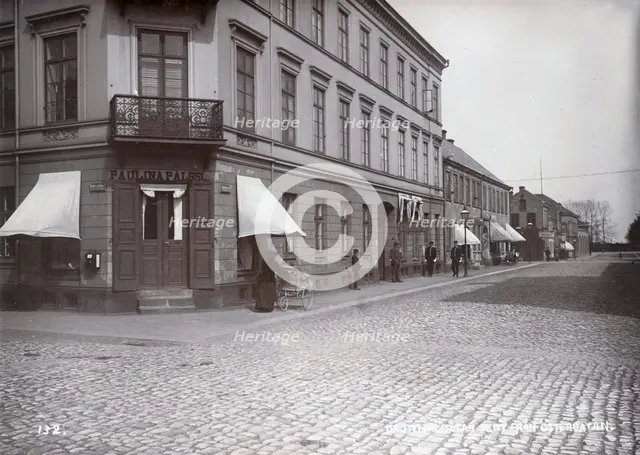 People walking on Queen's street, Landskrona, Sweden, 1900. Creator: Borg Mesch.