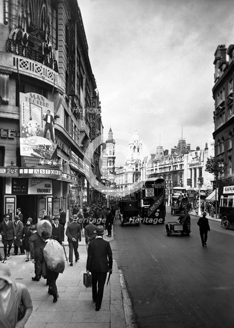 People walking past the Astoria Theatre in Charing Cross Road, Westminster, London, early 1930s.   Artist: George Davison Reid