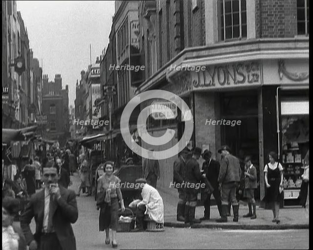 People Walking Past Shops, 1930s. Creator: British Pathe Ltd.