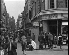 People Walking Past Shops, 1930s. Creator: British Pathe Ltd