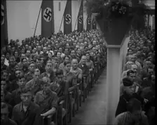 People Watching an Orchestra with Nazi Flags on the Walls, 1937. Creator: British Pathe Ltd