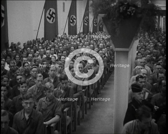 People Watching an  Orchestra with Nazi Flags on the Walls, 1937. Creator: British Pathe Ltd.