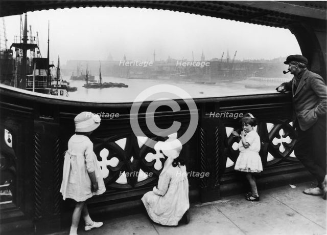 People watching the Thames from Tower Bridge, City of London, c1930. Creator: George Davison Reid.