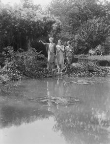 People wearing masks made by W.T. Benda, 1925 Sept. 20. Creator: Arnold Genthe