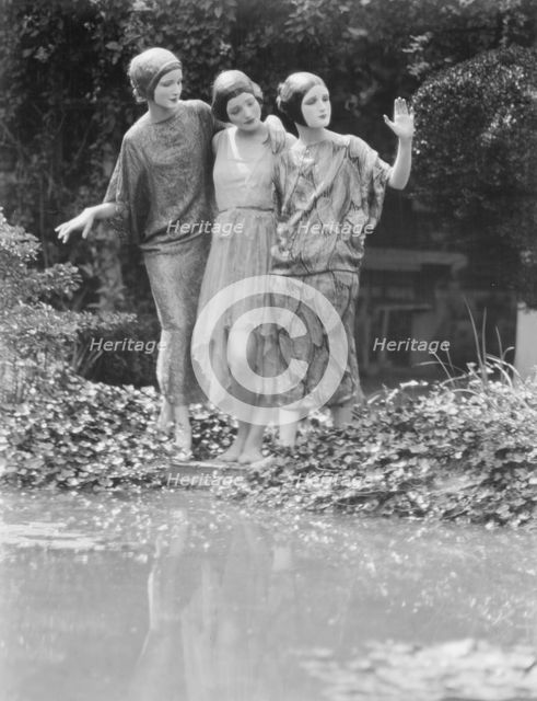 People wearing masks made by W.T. Benda, 1925 Sept. 20. Creator: Arnold Genthe.