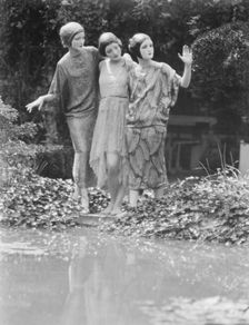 People wearing masks made by W.T. Benda, 1925 Sept. 20. Creator: Arnold Genthe
