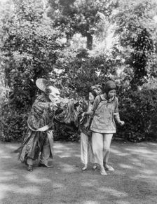 People wearing masks made by W.T. Benda, 1925 Sept. 20. Creator: Arnold Genthe