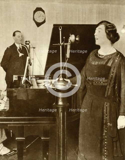 Performers singing a duet in one of the studios of 2LO, Savoy Hill, London, 1923, (1935). Creator: Unknown.