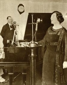 Performers singing a duet in one of the studios of 2LO, Savoy Hill, London, 1923, (1935). Creator: Unknown