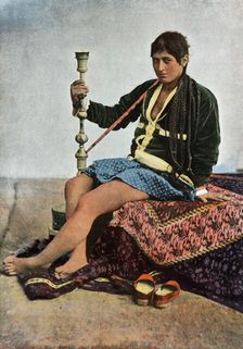 Persane Fumant Le Kalgan (Persian woman smoking in Kalgan), 1900. Creator: Unknown