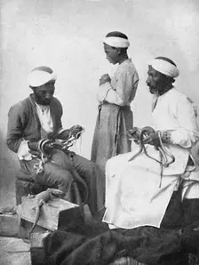 Persian snake charmers, 1902. Artist: W Rau