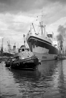Persic being guided up Woolwich Reach, London, c1945-c1965. Artist: SW Rawlings