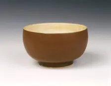 Persimmon red glazed Ding bowl with white glazed interior, Song dynasty, China, 12th century. Creator: Unknown