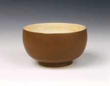 Persimmon red glazed Ding bowl with white glazed interior, Song dynasty, China, 12th century
