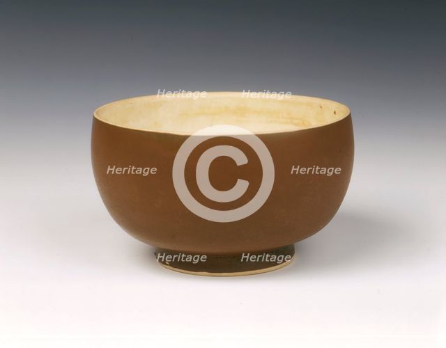 Persimmon red glazed Ding bowl with white glazed interior, Song dynasty, China, 12th century. Artist: Unknown
