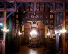 Perspective view of the main dining room of the Güell Palace with the original furniture, 1886-18…
