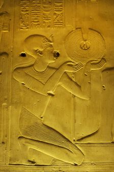 Pharaoh making an offering of a gold necklace, Temple of Seti I, Abydos, Egypt, New Kingdom (2003). Creator: LTL
