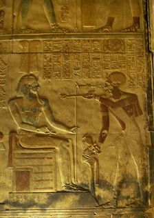 Pharaoh making offering of incense before a god, Temple of Seti I, Abydos, Egypt, New Kingdom (2003) Creator: LTL