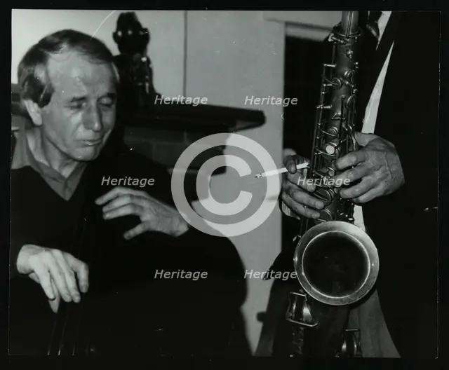 Phil Bates and the tenor saxophone of Spike Robinson at The Bell, Codicote, Hertfordshire, 1986. Creator: Denis Williams.