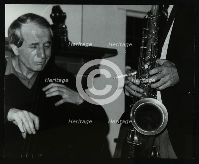 Phil Bates and the tenor saxophone of Spike Robinson at The Bell, Codicote, Hertfordshire, 1986. Artist: Denis Williams