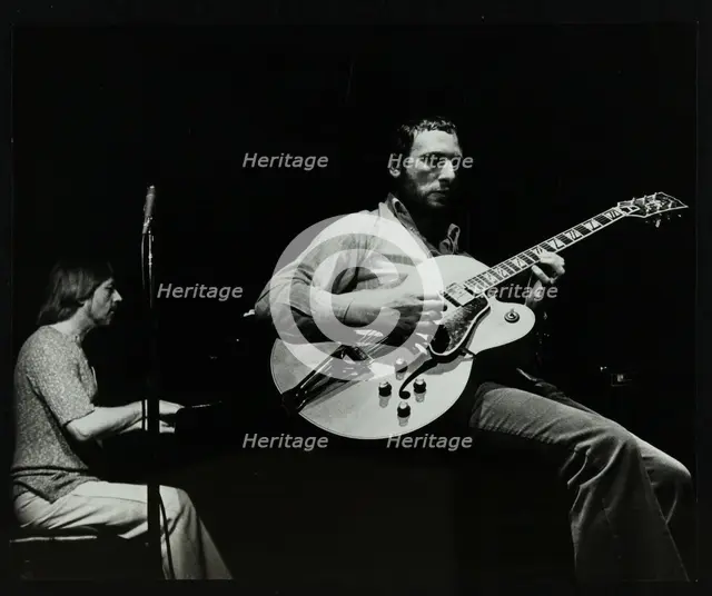Phil Lee (guitar) and Michael Garrick (piano) playing at The Stables, Wavendon, Buckinghamshire. Creator: Denis Williams.