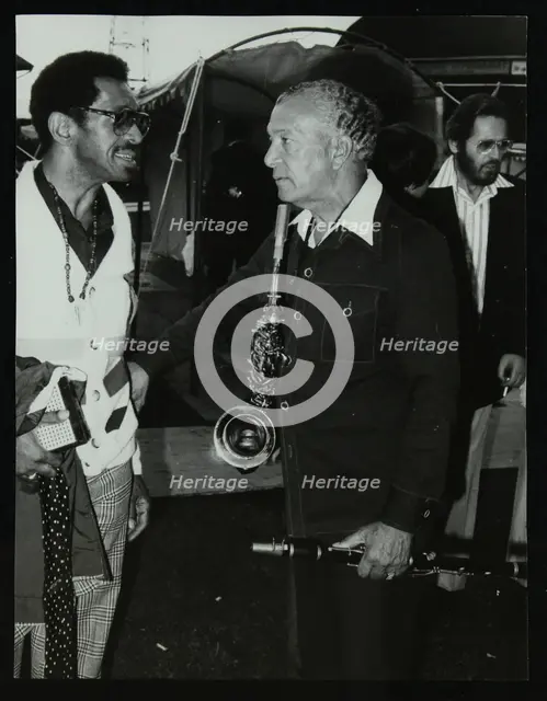 Philly Joe Jones and Earle Warren chatting at the Newport Jazz Festival, Middlesbrough, 1978. Creator: Denis Williams.