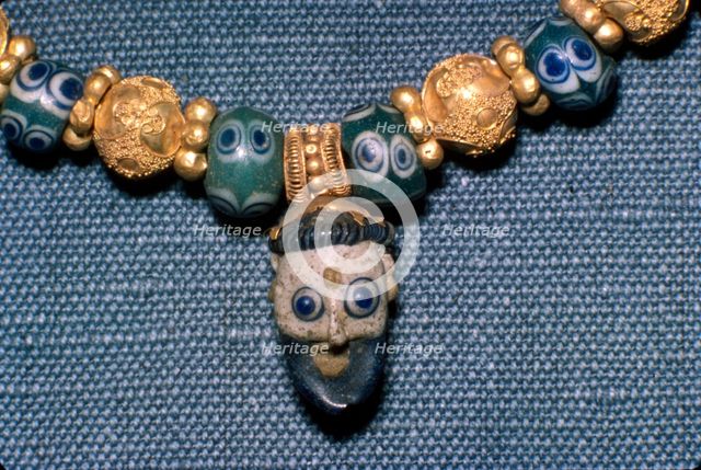 Phoenician glass head on Etruscan Necklace, c7th century BC. Artist: Unknown.