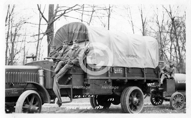 Photo of three soldiers sitting on a truck, Fort Sheridan, Illinois, USA, 1933. Artist: Unknown