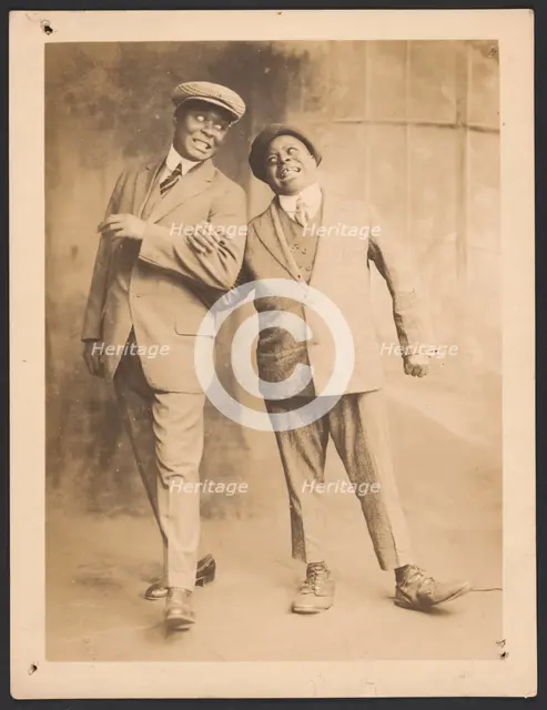 Photograph of two men linking arms, 1910s - 1920s. Creator: The Bell Studio.