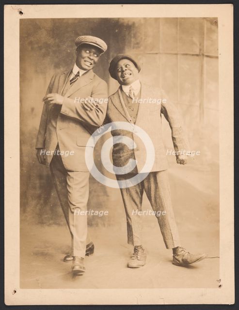 Photograph of two men linking arms, 1910s - 1920s. Creator: The Bell Studio.