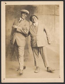 Photograph of two men linking arms, 1910s - 1920s. Creator: The Bell Studio