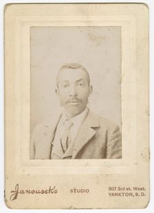 Photograph of a man wearing a light colored jacket, vest and necktie, late 19th century. Creator: Louis Janousek