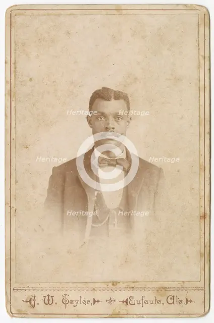 Photograph of a man in a suit, vest and necktie, 1880s - 1900. Creator: J. W. Taylor.