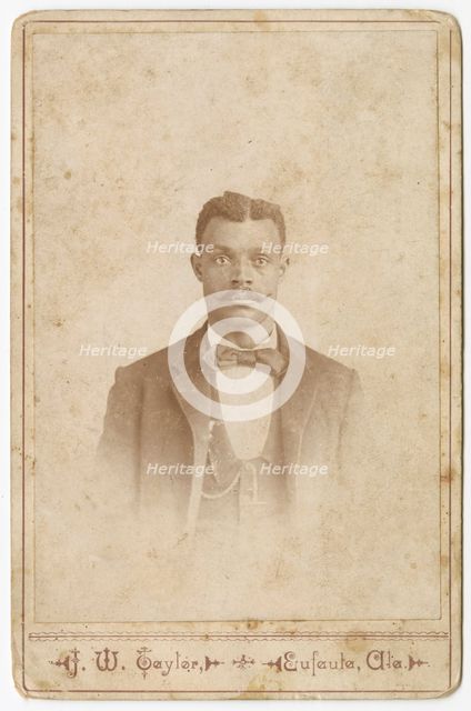 Photograph of a man in a suit, vest and necktie, 1880s - 1900. Creator: J. W. Taylor.
