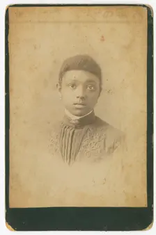 Photograph of a girl wearing a pleated dress, 1885-1900. Creator: Unknown