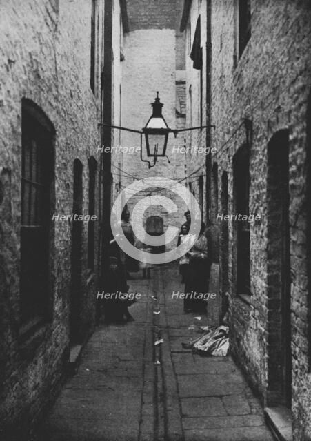 'Photograph of a sunless Court in Liverpool recently closed by the Health Committee of the City Coun Artist: Unknown.