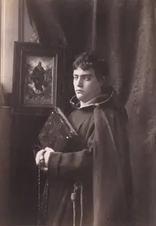 Photograph of a young man, wearing monastic robes, Taormina, Sicily, c1890s. Creator: Count Wilhelm von Gloeden
