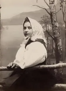 Photograph of a young girl in a white blouse and white headscarf, 1880-1890. Creator: Helene Edlund